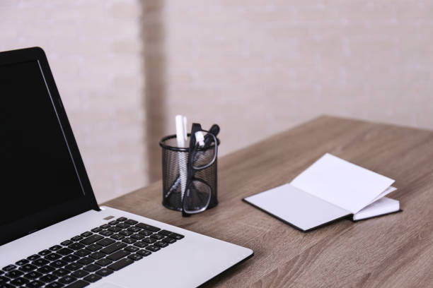 istock Workplace in corner office with laptop and bunch of accessories. 1222183679