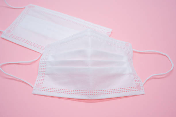 istock Non Woven Mask on pink background 1222184338