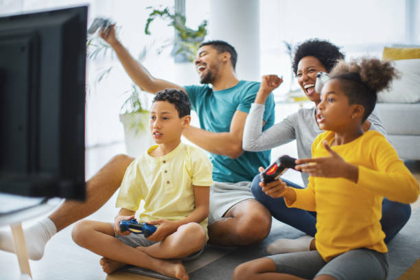 istock Family playing video games at home. 1222184414