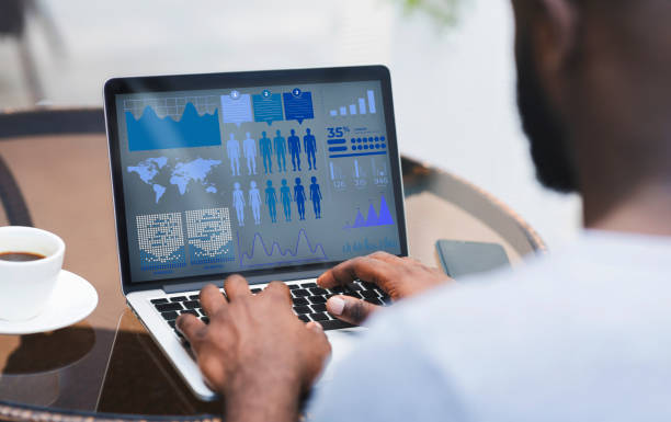 istock Man working on laptop with graphics and charts on screen 1222185084