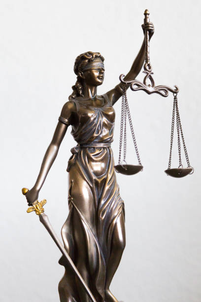 istock statue of Justitia with blindfold, sword and balance on white background 1222186603