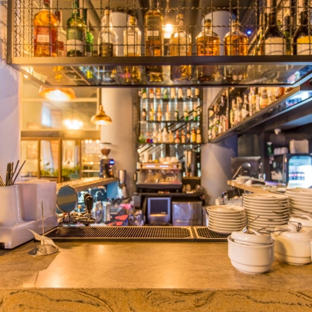 istock Clean dishes and view on bar counter in restaurant interior 1222186660