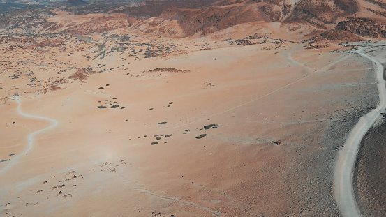 The desert in the mountains, the height of more than 2000 meters, sand and mountains. View from the drone. 2k