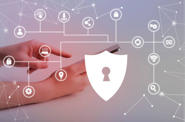 istock Woman holding phone with virtual security shield 1222187479