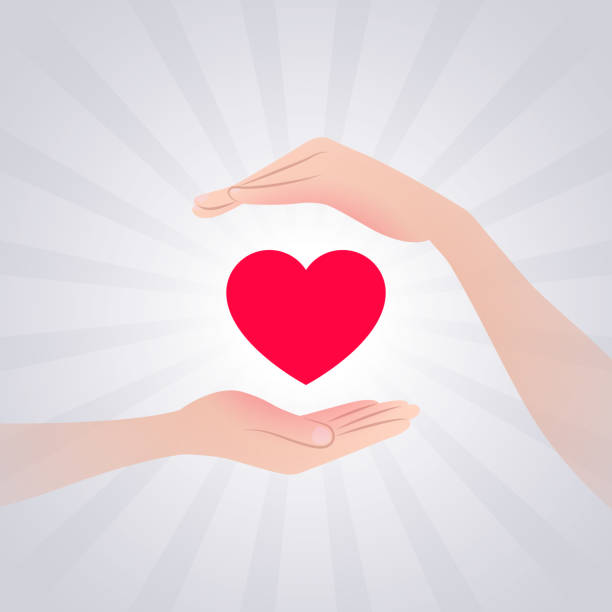 istock Red heart and hands near it, hands are carefully protecting heart 1222187539