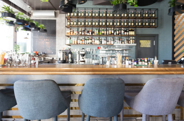 istock Bar counter with soft chairs in cafe with no visitors 1222187660
