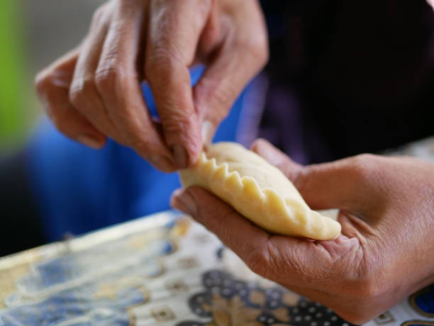 istock Making manadonese tuna stuffed bread/pastry (panada) 1222187725