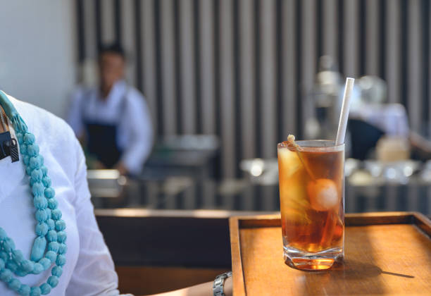 Isolated Glass of Iced Tea with Lemon Slice and Ice Cubes