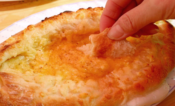 istock Adjaruli Khachapuri, Popular Traditional Georgian Cheese and Egg Bread 1222188080