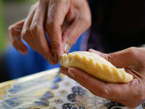 istock Making manadonese tuna stuffed bread/pastry (panada) 1222188099