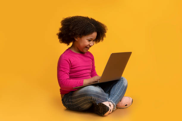 istock Modern Technologies For Kids. Black girl sitting with laptop on lap 1222189790