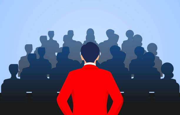 Leader stands in front of a group of people speaking Leader stands in front of a group of people speaking chief leader stock illustrations