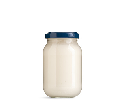 mayonnaise or dressing in bottle on white background