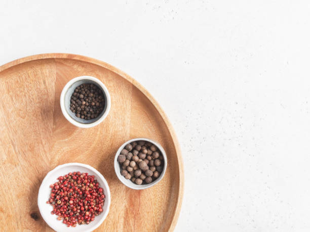 istock Kitchen minimalism concept. Various spices in small bowl on wood tray on light background. Top view. Copy space 1222196099