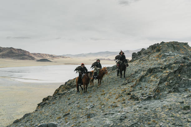 istock Eagle hunter on horse in desert in Mongolia 1222198239