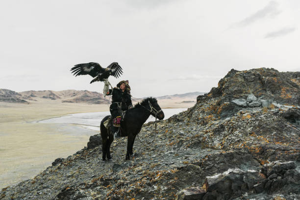 istock Eagle hunter on horse in desert in Mongolia 1222198253