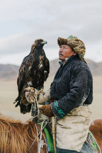 istock Eagle hunter on horse in desert in Mongolia 1222198514