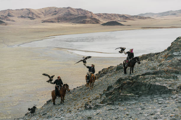 istock Eagle hunter on horse in desert in Mongolia 1222198516
