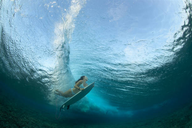 istock Surfer girl Duck Dive 1222200644