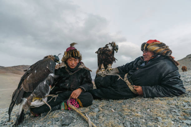 istock Eagle hunters resting in mountains in desert in Mongolia 1222200967