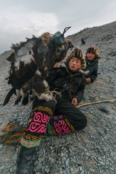 istock Eagle hunters resting in mountains in desert in Mongolia 1222200971