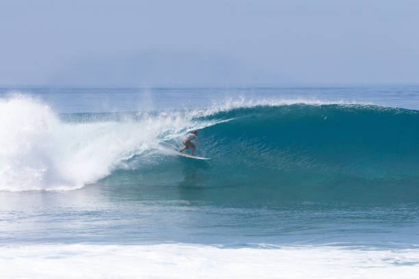 istock Surfer girl perfect barrel 1222201521