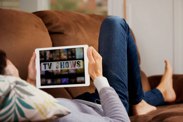istock man and tablet with the text tv shows in it 1222201989