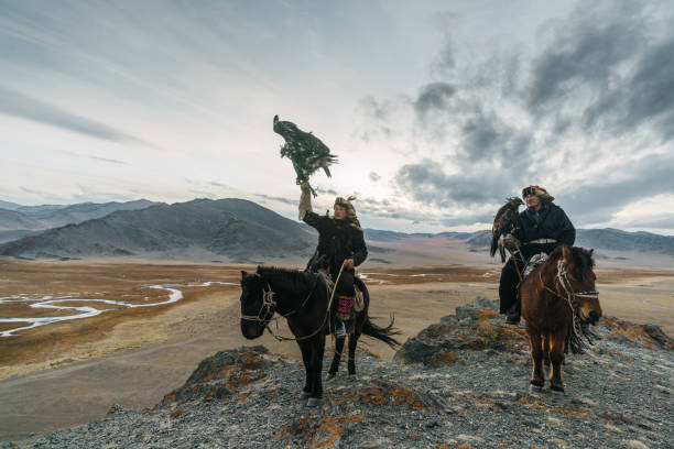istock Eagle hunters on the background of river in Gobi desert in Mongolia 1222202007