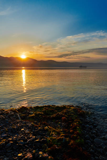 istock Dawn over the sea and mountains 1222202781