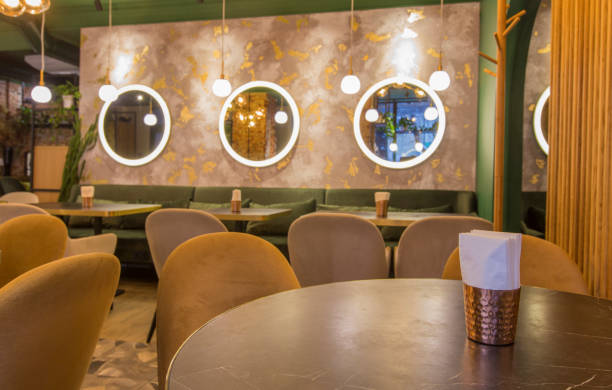 istock Light modern interior of urban restaurant or cafe with dining places 1222203202