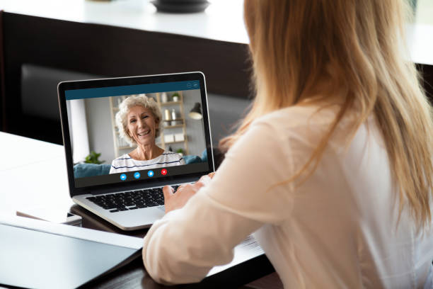 istock Happy middle aged woman making video call with young daughter. 1222204145
