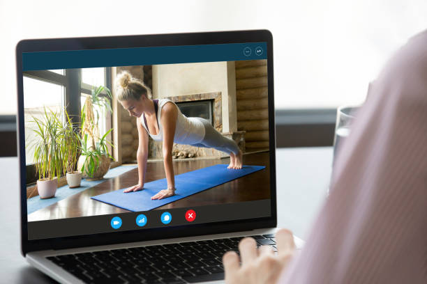 istock Computer screen with fit young woman standing in plank position. 1222204163