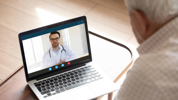 istock Happy male general practitioner consulting older mature patient. 1222204169