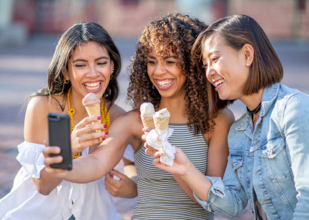istock Group of friends eating ice cream 1222204219