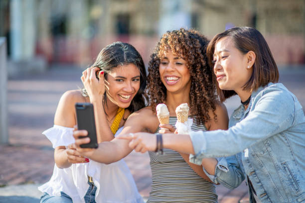 istock Group of friends eating ice cream 1222204226