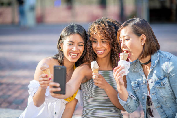 istock Group of friends eating ice cream 1222204227