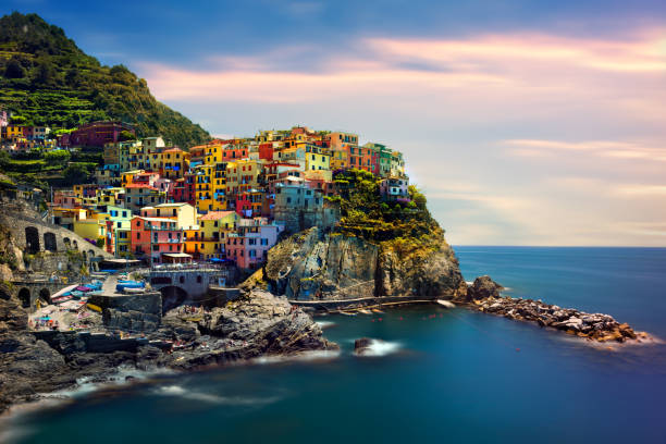 Coastal fishing village Beautiful landscape of a coastal fishing village, amazing view on many little colorful houses, traditional architecture of the little Italian town called Cinque Terre spezia stock pictures, royalty-free photos & images