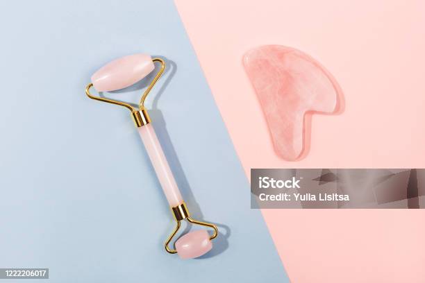 Pink Jade Roller And Gua Sha Tool On Pastel Background Stock Photo - Download Image Now