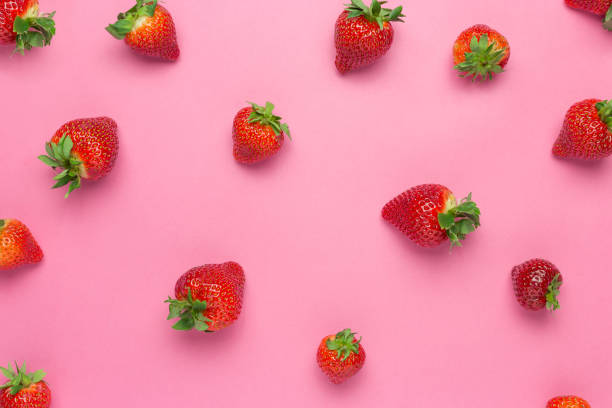 istock Ripe juicy strawberries on a pink background. Pattern, Fresh berry flat lay. Creative Minimal food concept. Copy space 1222206211