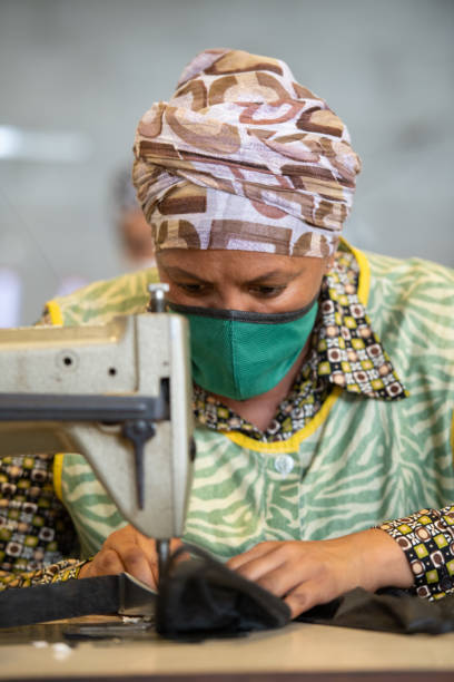 istock Seamstress sewing face mask portrait 1222207037