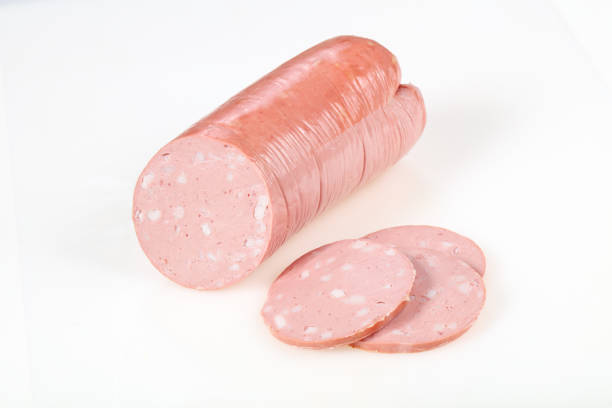 istock Tasty meat sausages over white background 1222209099