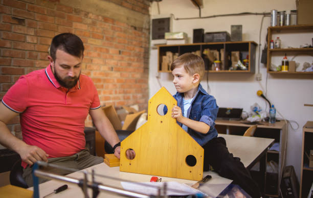 istock Father and Son Making a Birdhouse 1222209233