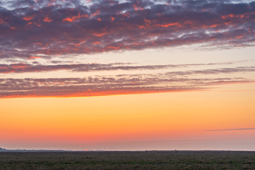 Colorful clouds on panoramic sunset sky. This file is cleaned and retouched.