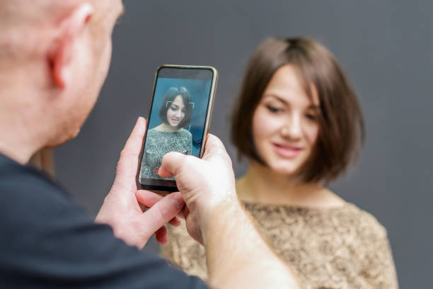 istock Young man photographing a girl 1222215367