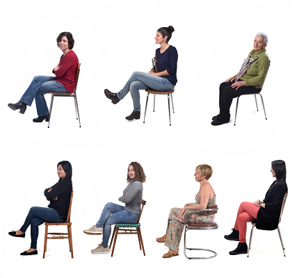 group of women sitting on chair on white background, side view