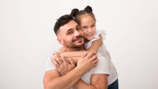 Loving daughter and her daddy embracing, panorama