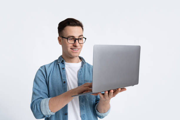 istock Freelancer works online. Guy in glasses with laptop 1222217340