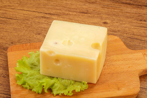 istock Emmental cheese over wooden board 1222220011
