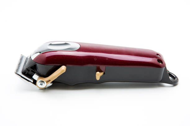 istock Red clippers for cutting hair on a white background 1222220506