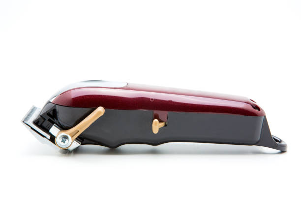 istock Red clippers for cutting hair on a white background 1222220582